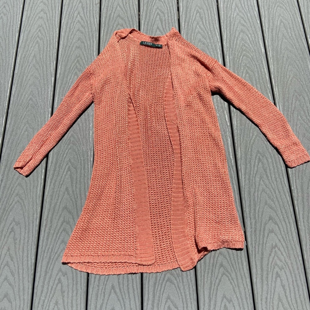 Light orange cardigan.